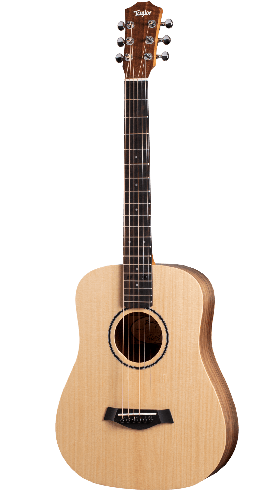 The image shows a Taylor small-bodied acoustic guitar, likely from the Academy or entry-level series. It features a natural spruce top, darker wood back and sides, and a dark rosewood or ebony fretboard. Chrome tuning pegs (3+3), a black bridge, and a round soundhole with a dark rosette are visible. The guitar has a clean, simple design, suitable for beginners to intermediate players and various acoustic styles.
