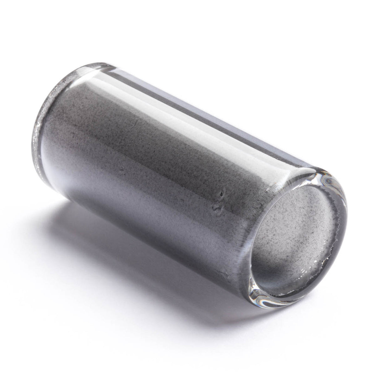 Clear glass cylindrical guitar slide on a white background