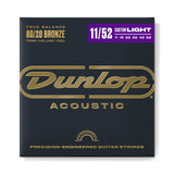 The image shows a package of Dunlop Acoustic guitar strings made with 80/20 Bronze for balanced tone, volume, and feel. It’s a Custom Light set (11-52 gauge) with precision-engineered strings (11, 15, 22, 32, 42, 52). The packaging features a dark charcoal background, gold Dunlop logo, and a purple accent bar highlighting the gauge, exuding a professional, premium look.