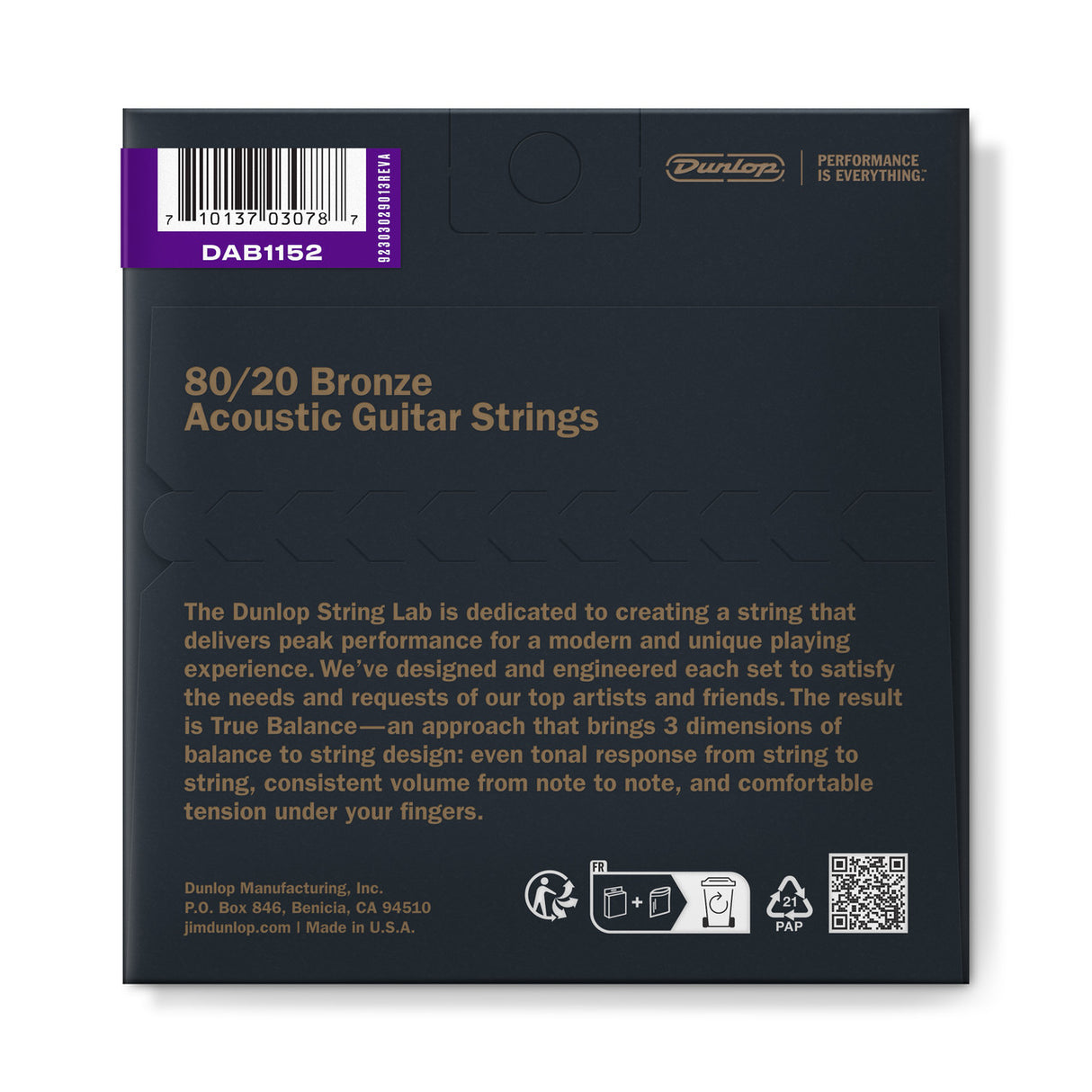 The image shows a package of Dunlop 80/20 Bronze Acoustic Guitar Strings, model DAB1152. The dark package features gold text, the Dunlop logo, and the tagline "Performance is Everything." It includes a barcode on a purple label, product details about Dunlop’s "True Balance" design, company info from Benicia, CA, a "Made in U.S.A." mark, recycling icons, and a QR code for more info.