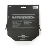 The image shows the back packaging of a Dunlop MXR Standard Series Instrument Cable (model DCIS15), a guitar/instrument cable with 24 AWG oxygen-free copper conductor, 90% shield coverage, polyethylene insulation, and a flexible PVC jacket. It features heat-shrink tubing for strain relief, a conductive plastic shield, and thick jacket for durability. It has 1/4" phone plugs and is designed for reliable, tangle-free use by musicians.