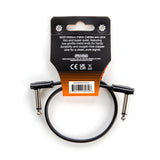 The image shows an MXR Ribbon Patch Cable by Dunlop, a short, flat 6-inch cable with right-angle 1/4" connectors. Designed for connecting guitar effects pedals on a pedalboard, it features low-profile metal ends and oxygen-free copper wire for durability and clean signal. The packaging includes Dunlop branding and product info. This cable is ideal for tight pedalboard spaces, keeping connections neat and compact.