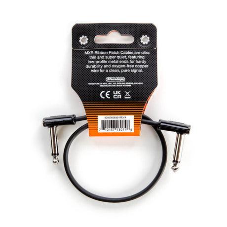 The image shows an MXR Ribbon Patch Cable by Dunlop, a short, flat 6-inch cable with right-angle 1/4" connectors. Designed for connecting guitar effects pedals on a pedalboard, it features low-profile metal ends and oxygen-free copper wire for durability and clean signal. The packaging includes Dunlop branding and product info. This cable is ideal for tight pedalboard spaces, keeping connections neat and compact.