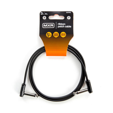 The image shows an MXR DCPR3 ribbon patch cable, a 3-inch (9 cm) black audio cable with right-angle connectors. It features flat, flexible design for easy cable management, ideal for connecting effects pedals and audio gear on pedalboards. The packaging is orange and black with badge icons highlighting product features, designed to save space and reduce cable stress in tight setups.