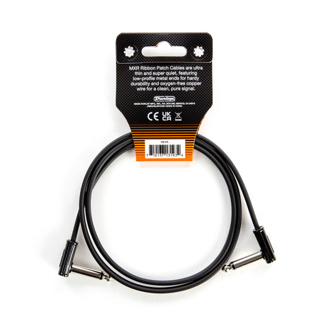 The image shows an MXR Ribbon Patch Cable by Dunlop, a black, flat, ultra-thin cable with two right-angled metal jack plugs. Packaged with a black and orange header card, it’s a short cable designed for connecting guitar effects pedals. The packaging highlights its ultra-thin, quiet design, low-profile metal ends, and oxygen-free copper wire for durability and clean signal transmission.