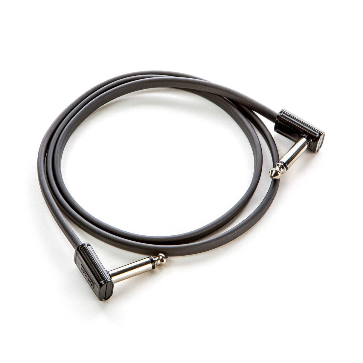 The image shows a short guitar patch cable with 1/4-inch TS right-angled connectors on both ends. It has a dark gray or black jacket and silver metal plugs. Commonly used to connect electric guitars, basses, keyboards, or pedals to amplifiers or audio gear, this compact cable is essential for clean, reliable signal routing in musical setups, especially on pedalboards.