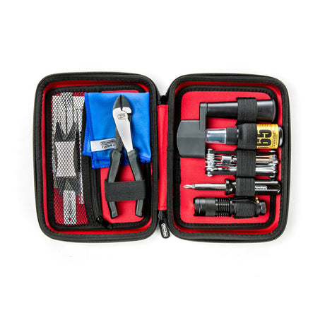 Open tool kit with various tools on a white background