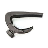 A metallic guitar capo on a white background.
