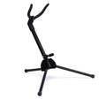 A black tenor saxophone stand on a white background