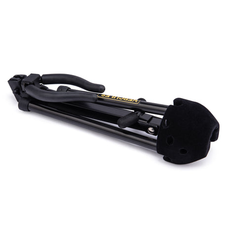 A black saxophone stand folded up on a white background