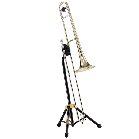 A gold trombone resting on a black trombone stand with Hercules branding on a white background