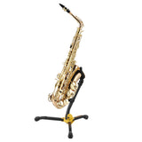 A gold saxophone resting on a black and yellow saxophone stand on a white background