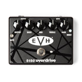 The image shows an EVH 5150 Overdrive guitar pedal with a black finish and iconic EVH striped graphics. It has five knobs: OUTPUT, BASS, MID, TREBLE, and GAIN, plus a GATE control for noise reduction, a BOOST switch, and a footswitch. Input and output jacks are at the top. This pedal delivers high-gain distortion, emulating Eddie Van Halen’s signature 5150 amp tone, popular with rock and metal guitarists.