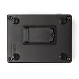 The image shows the underside of a black rectangular musical effects pedal, featuring four rubber feet, a central battery compartment likely for a 9V battery, and four corner screws. The "MXR" brand name is embossed on the bottom left, indicating it is a guitar effects pedal used to modify instrument sound with various audio effects.