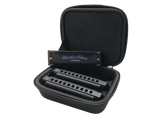 The image shows a Hohner "Hoodoo Blues" harmonica set featuring 2-3 harmonicas in different keys (including C and G) inside a black zippered carrying case with foam compartments. The case keeps the instruments organized and protected. Hohner is a well-known German brand, and this set is designed specifically for blues music, popular among musicians needing multiple keys in one portable kit.