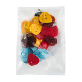 Packaged set of colorful thumbpicks with 'Herco' branding on a white background