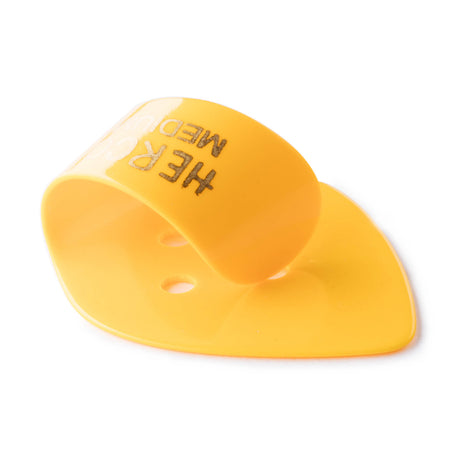 Yellow plastic thumbpick on a white background
