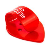 Red plastic thumbpick on a white background