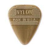 Gold guitar pick on a white background