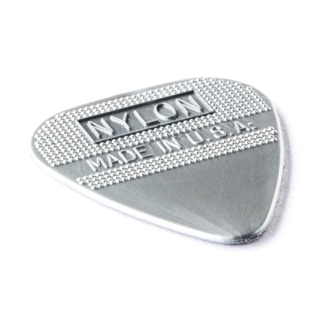 Metallic guitar pick with 'Nylon Made in U.S.A.' text on a white background