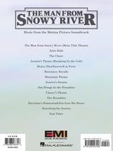 The image shows the cover of a sheet music book for "The Man from Snowy River" movie soundtrack. It lists 13 tracks, including themes like "Jim’s Ride," "Jessica’s Theme," and "The Chase." Published by EMI Music Publishing and distributed by Hal Leonard, the book features UPC and ISBN codes, indicating a commercial release for musicians to perform the film’s score. The cover has a simple, professional design with a gradient background.