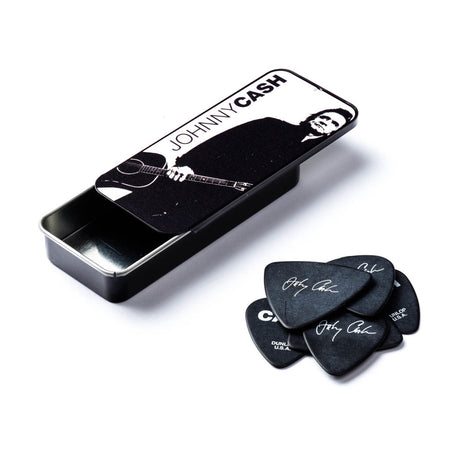 Set of Johnny Cash branded guitar picks with a metal case on a white background