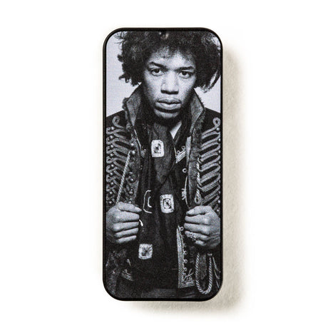 Jimi Hendrix pick tin on a white background