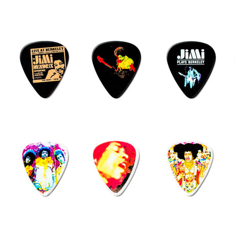 Set of six guitar picks with colorful designs on a white background