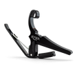 The image shows a Kyser Quick-Change guitar capo with a black finish and spring-loaded, curved arms. The "KYSER" branding is visible on its C-shaped clamp, designed for quick release and easy movement along the fretboard. This popular capo raises pitch by clamping all strings, allowing guitarists to change keys without new fingerings. Kyser capos are known for durability, reliable intonation, and protecting guitar necks.