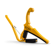 The image shows a Kyser Quick-Change guitar capo, featuring a bright yellow/gold spring-loaded design. It has black rubber padding to protect the guitar neck, even pressure across strings, and the "KYSER" logo. Made of durable metal, it enables quick one-handed use. This popular capo is favored by guitarists for easily changing keys while keeping chord shapes, widely used across many music genres.