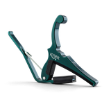The image shows a Kyser spring-loaded guitar capo with a green anodized aluminum finish. It features a curved clamp, black rubber padding to protect the guitar neck, and a quick-change design for one-handed use. The Kyser logo is visible on the body. This durable, lightweight capo is popular for easily shifting keys on acoustic and electric guitars.