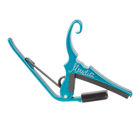 A teal Kyser guitar capo with 'Meredith' signature on a white background