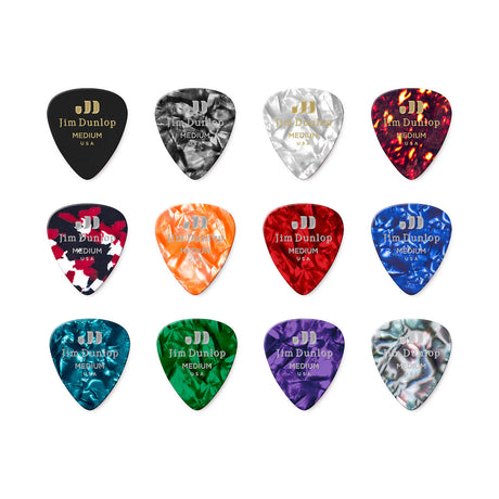 Set of Jim Dunlop guitar picks in various colors on a white background