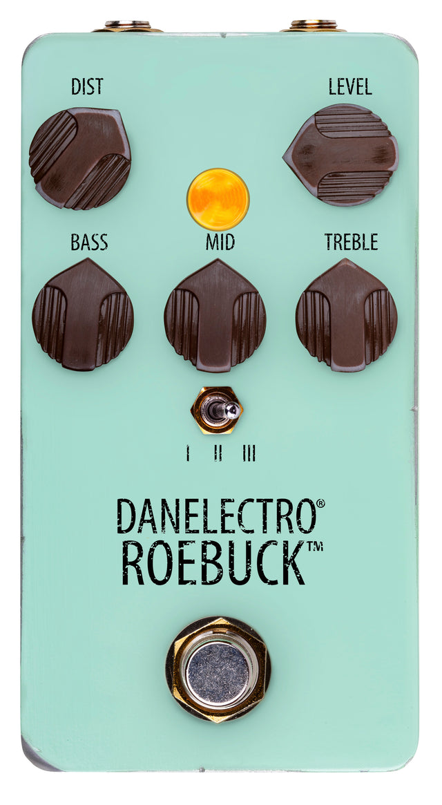 The image shows a Danelectro Roebuck guitar effects pedal in mint green. It is a distortion/overdrive pedal with controls for Distortion, Level, Bass, Mid, and Treble. It has an orange LED, a 3-position toggle switch for distortion modes, a footswitch, and input/output jacks at the top. Designed for tone shaping, it is popular for adding overdrive and vintage-style sounds to guitar setups.