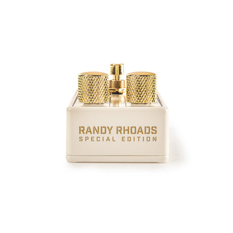 The image shows gold-finished guitar tuning pegs with knurled knobs mounted on a cream base engraved with "RANDY RHOADS SPECIAL EDITION." These premium machine heads are high-quality, precision-made components designed for tuning guitar strings, combining functional engineering with an elegant finish. They are likely signature or tribute tuners aimed at guitarists seeking both performance and stylish hardware upgrades.