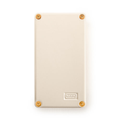 The image shows the back panel of an MXR guitar effects pedal. The panel is cream-colored with four brass screws at the corners and features the embossed or printed "MXR" logo. MXR is a well-known brand of effects pedals, which musicians use to alter their instrument's sound with effects like distortion, delay, and reverb.