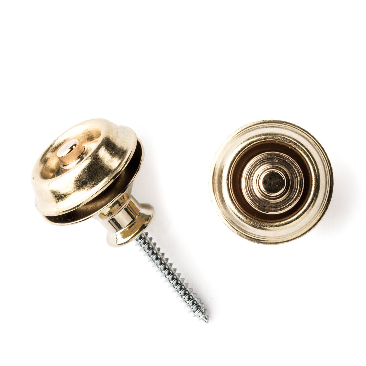 A pair of guitar straplocks with a brass finish on a white background