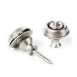 A pair of guitar straplocks with a vintage nickel finish on a white background