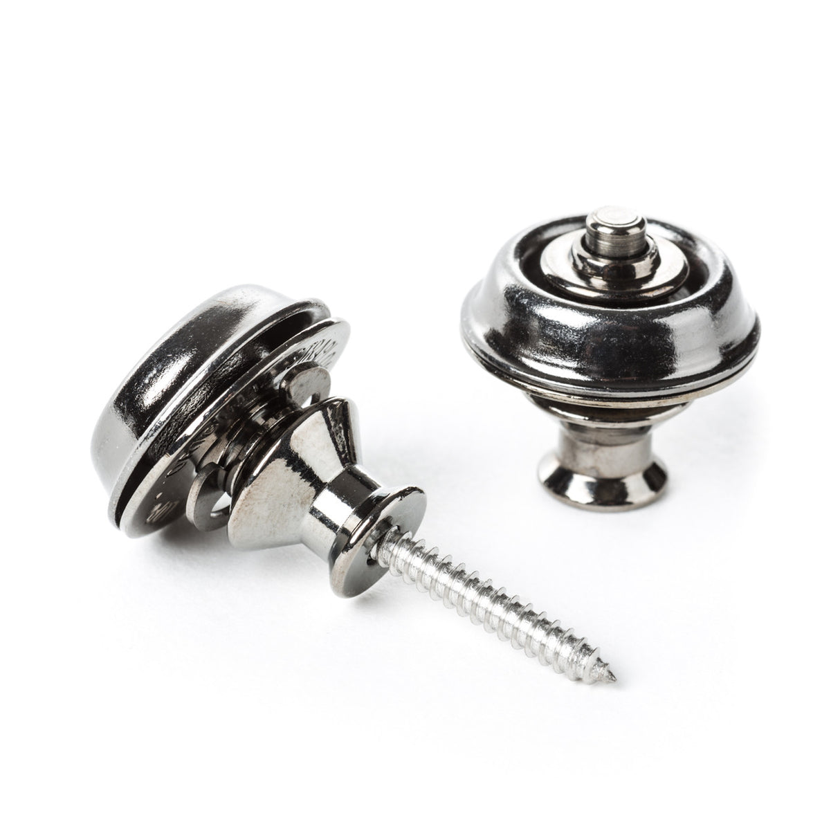 A pair of guitar straplocks with a black nickel finish on a white background