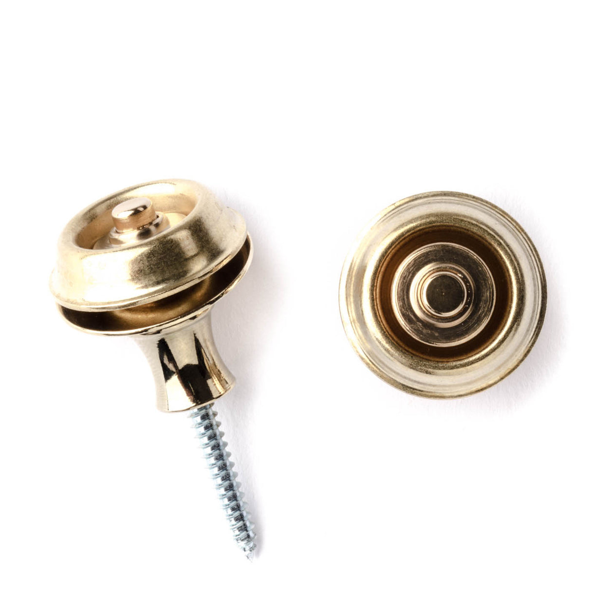 A pair of guitar straplocks with a brass finish on a white background