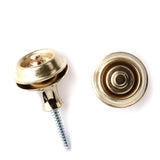 A pair of guitar straplocks with a brass finish on a white background
