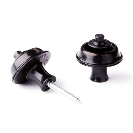 A pair of guitar straplocks with a black finish on a white background