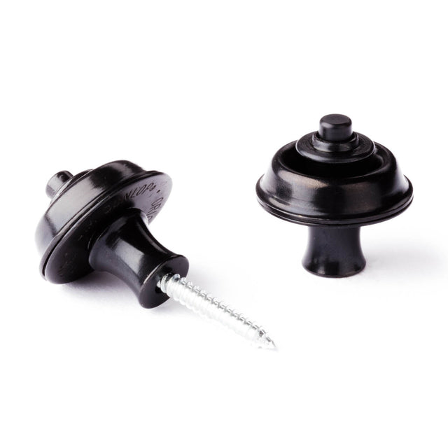 A pair of guitar straplocks with a black finish on a white background