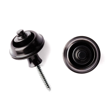 A pair of guitar straplocks with a black finish on a white background