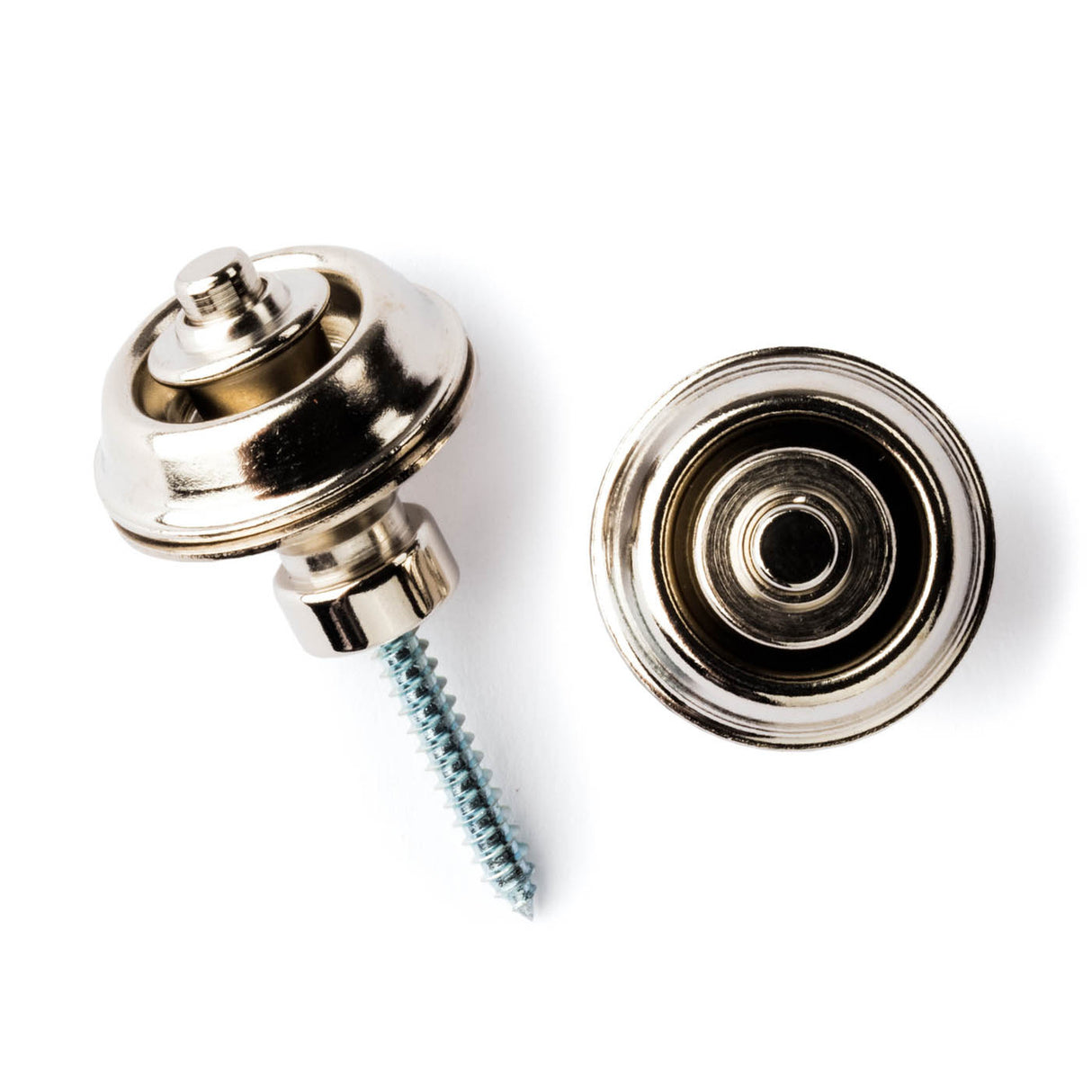 A pair of guitar straplocks with a nickel finish on a white background