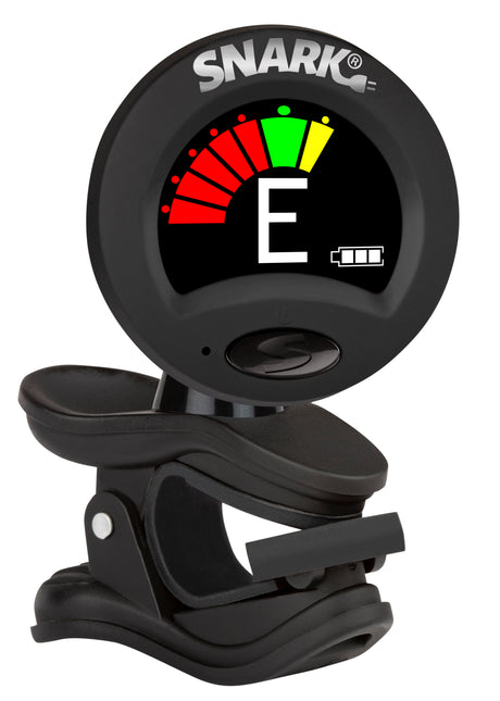 The image shows a Snark clip-on chromatic tuner with a black, compact design. It features a circular color-coded LCD display indicating note pitch, a semicircular tuning meter, and a battery indicator. The tuner has a spring-loaded clip and a rotating head for easy attachment and viewing. Popular among string instrument players, it detects vibrations for accurate tuning even in noisy settings.