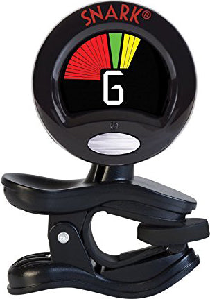 The image shows a Snark clip-on guitar tuner with a circular display featuring red, yellow, and green LED indicators, and the number "6" visible. It has a black clip for attaching to a guitar headstock and the "SNARK" logo at the top. This chromatic tuner detects string vibrations and signals tuning accuracy, with red for sharp/flat and green for in-tune.