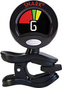 The image shows a Snark clip-on guitar tuner with a circular display featuring red, yellow, and green LED indicators, and the number "6" visible. It has a black clip for attaching to a guitar headstock and the "SNARK" logo at the top. This chromatic tuner detects string vibrations and signals tuning accuracy, with red for sharp/flat and green for in-tune.