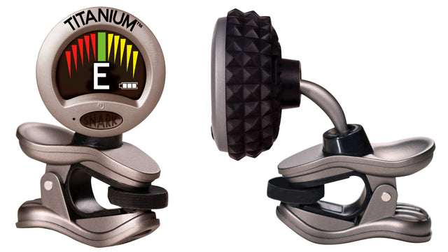 The image shows a Snark Titanium clip-on electronic tuner with a digital LCD displaying the note "E" and a colorful LED indicator bar signaling pitch accuracy. It features a titanium finish, strong spring-loaded clip, flexible gooseneck arm, and compact design. Used for chromatic tuning of stringed instruments, it’s a popular, portable tool for quick and precise tuning.