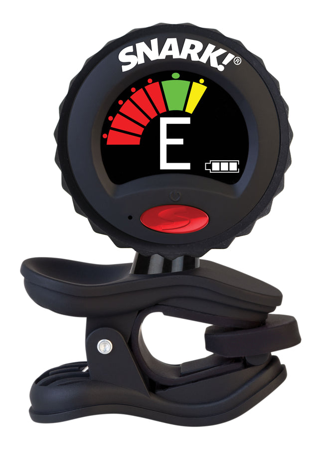 The image shows a SNARK clip-on electronic tuner with a circular LCD displaying a chromatic interface. It features a red power button, a color-coded meter (red, yellow, green) indicating flat, in tune, or sharp, and the letter “E” showing the detected note. The black clip attaches to stringed instruments, and a battery icon is visible. Known for accuracy and convenience, it tunes all 12 chromatic notes.